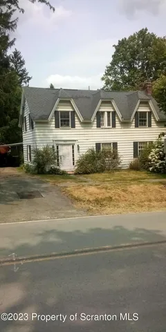 a front view of a house with a ocean view