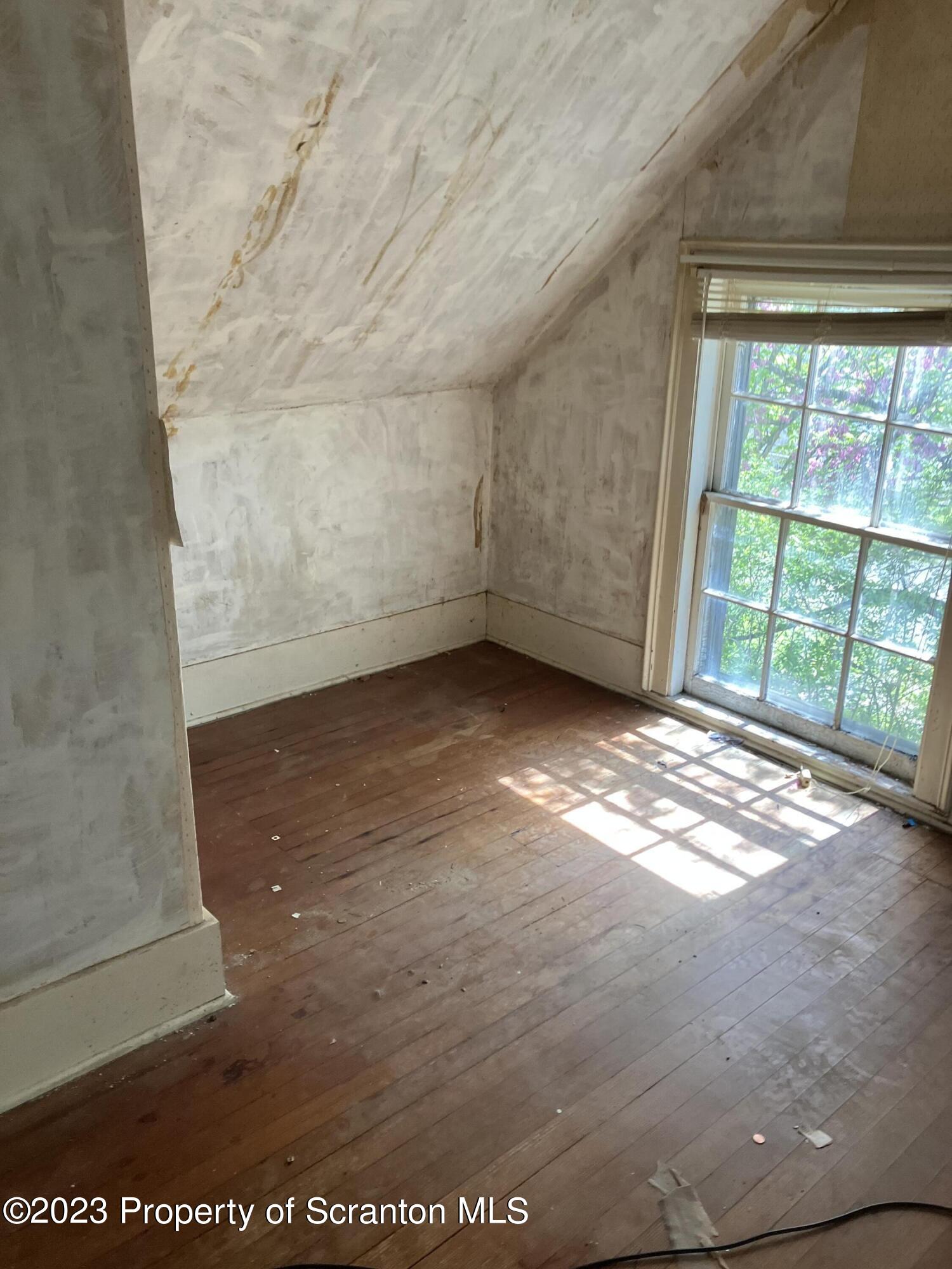 321 Maple Street Montrose, PA 18801 - Photo 25 of 28 a view of an empty room with a window