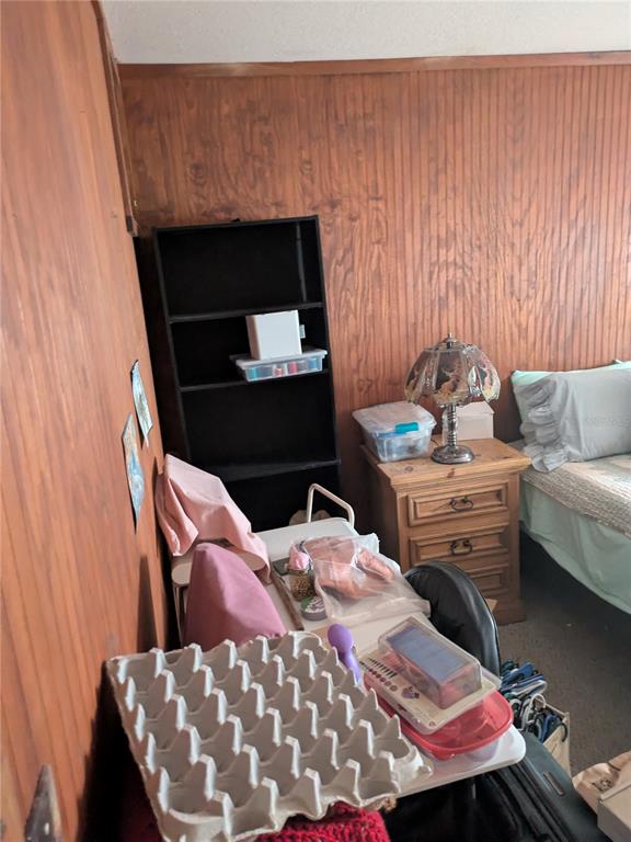 2833 Southwest Wilson Springs Road Fort White, FL 32038 - Photo 12 of 27 a bed room with a bed chair and a couch