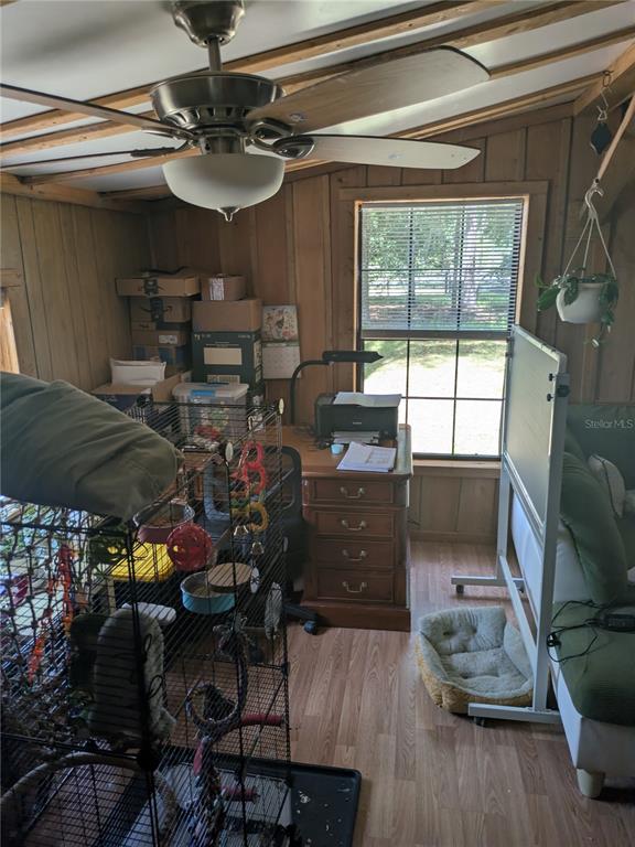 2833 Southwest Wilson Springs Road Fort White, FL 32038 - Photo 18 of 27 a view of a workspace with furniture and a window