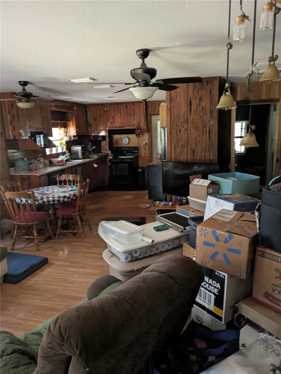 2833 Southwest Wilson Springs Road Fort White, FL 32038 - Photo 20 of 27 a living room with lots of furniture and kitchen view