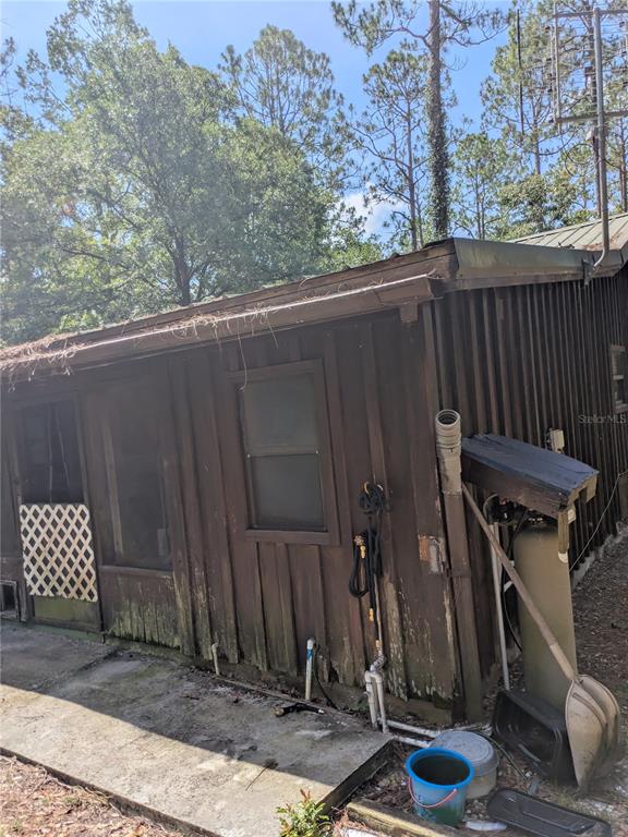 2833 Southwest Wilson Springs Road Fort White, FL 32038 - Photo 23 of 27 a view of a backyard with a small cabin