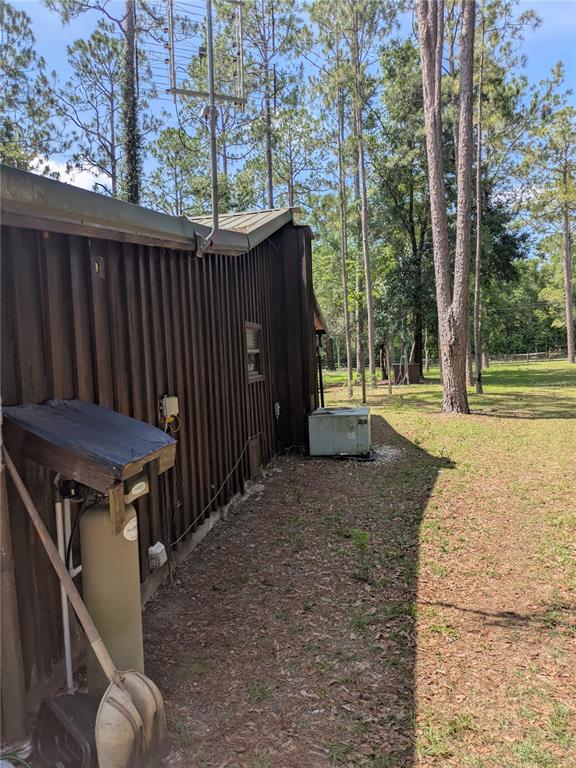 2833 Southwest Wilson Springs Road Fort White, FL 32038 - Photo 24 of 27 a view of a backyard with a trees