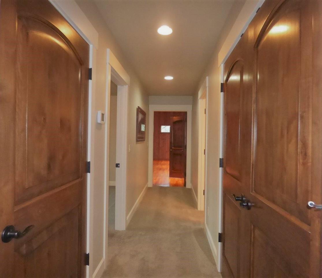 2144 Southwest Allen Creek Road Grants Pass, OR 97527 - Photo 28 of 55 Hallway to recreation room, third bedroom, bathroom. Extra storage along the way!