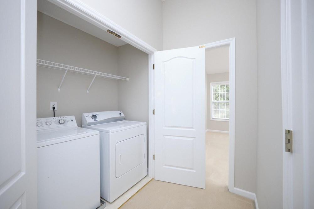 1437 Basinger Court Raleigh, NC 27612 - Photo 17 of 30 Laundry area on 2nd floor with exttra storage Hallway on Main Level