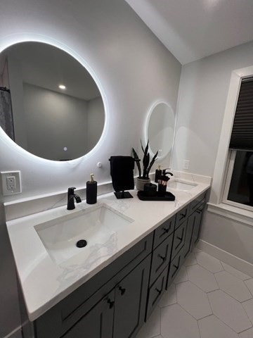 6 Rivendell Lane Millis, MA 02054 - Photo 29 of 33 a bathroom with a double vanity sink and a mirror
