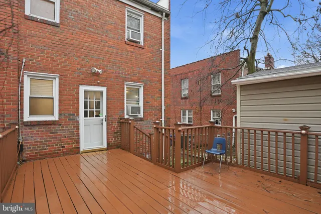a view of a brick house with wooden floor
