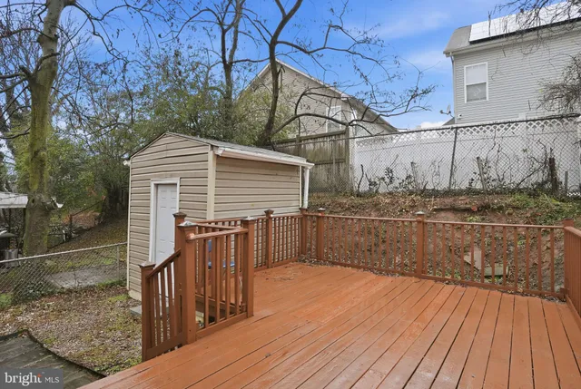 a view of backyard with small cabin