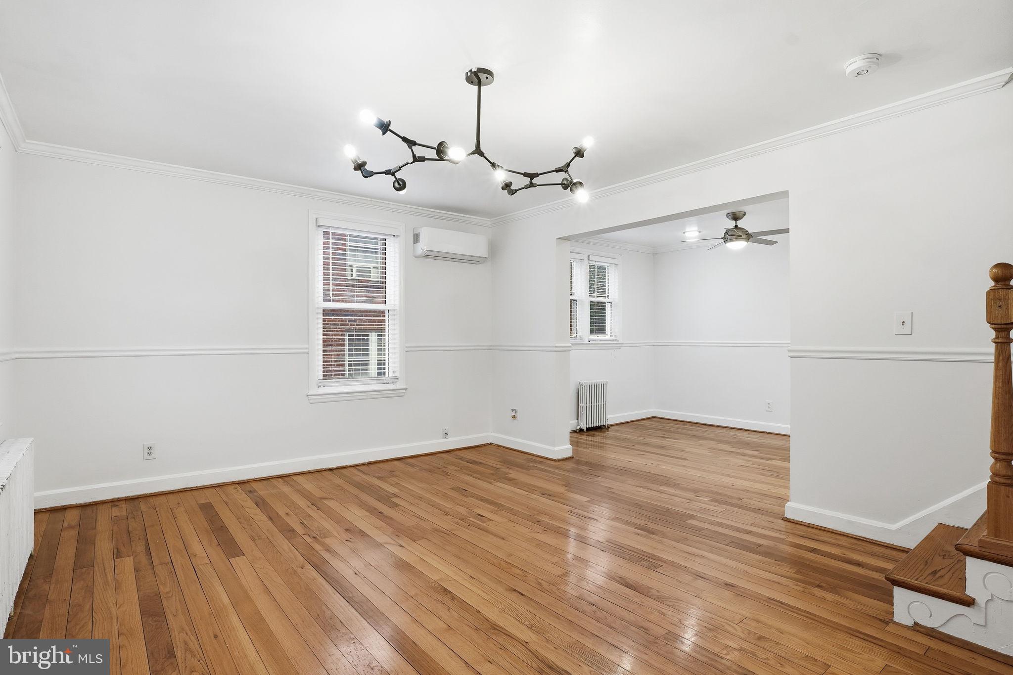 742 Congress Street Southeast Washington, DC 20032 - Photo 6 of 33 a view of empty room with wooden floor and ceiling fan