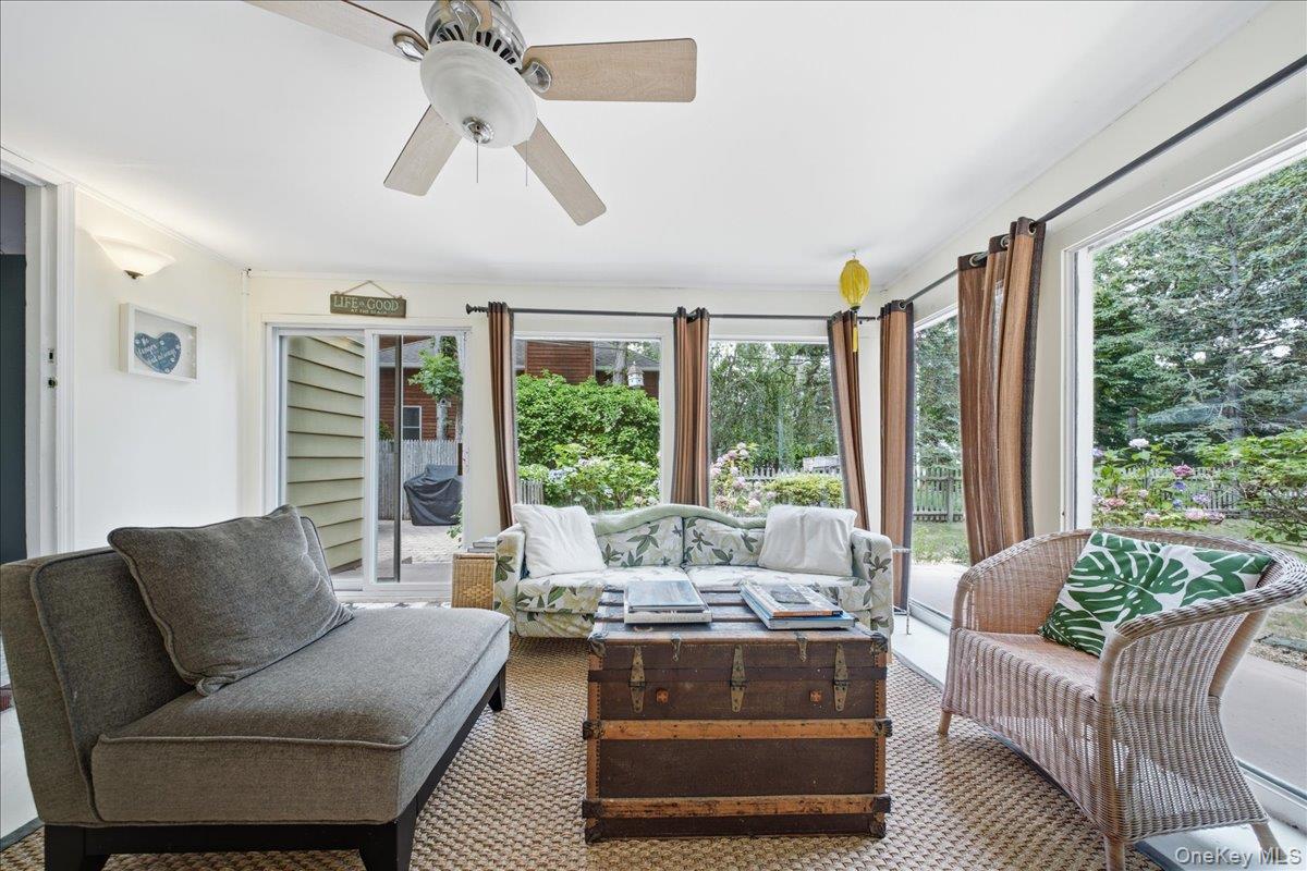 10 Graham Road Hampton Bays, NY 11946 - Photo 21 of 26 a living room with furniture and a large window