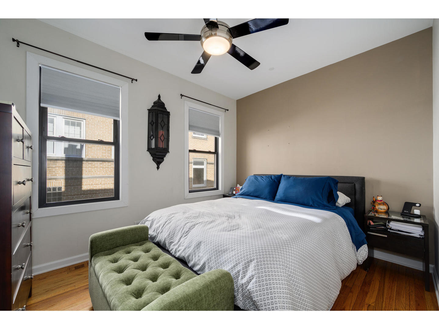 4500 North Harding Avenue Chicago, IL 60625 - Photo 12 of 29 a bedroom with a large bed and a chandelier