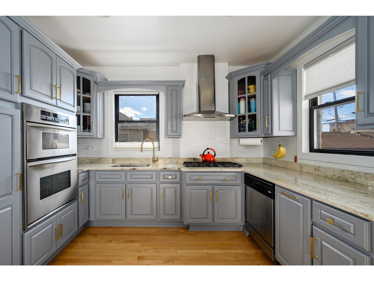 4500 North Harding Avenue Chicago, IL 60625 - Photo 8 of 29 a kitchen with stainless steel appliances granite countertop a sink stove and refrigerator