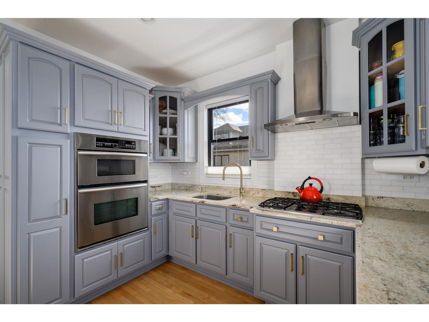 4500 North Harding Avenue Chicago, IL 60625 - Photo 9 of 29 a kitchen with stainless steel appliances granite countertop a sink stove and cabinets