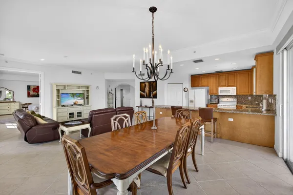 a kitchen with sink and view living room