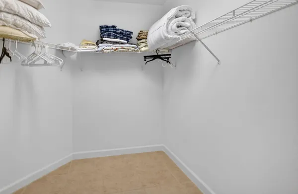 a bathroom with a sink a toilet a mirror and shower