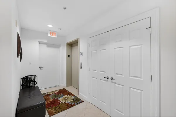 a view of a hallway with a bathroom