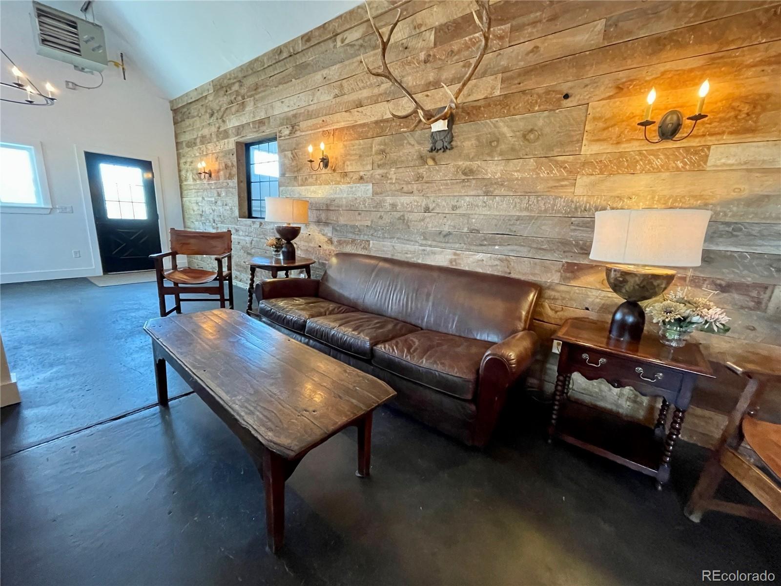 26794 Maul Road Elbert, CO 80106 - Photo 12 of 44 a living room with furniture and wooden floor