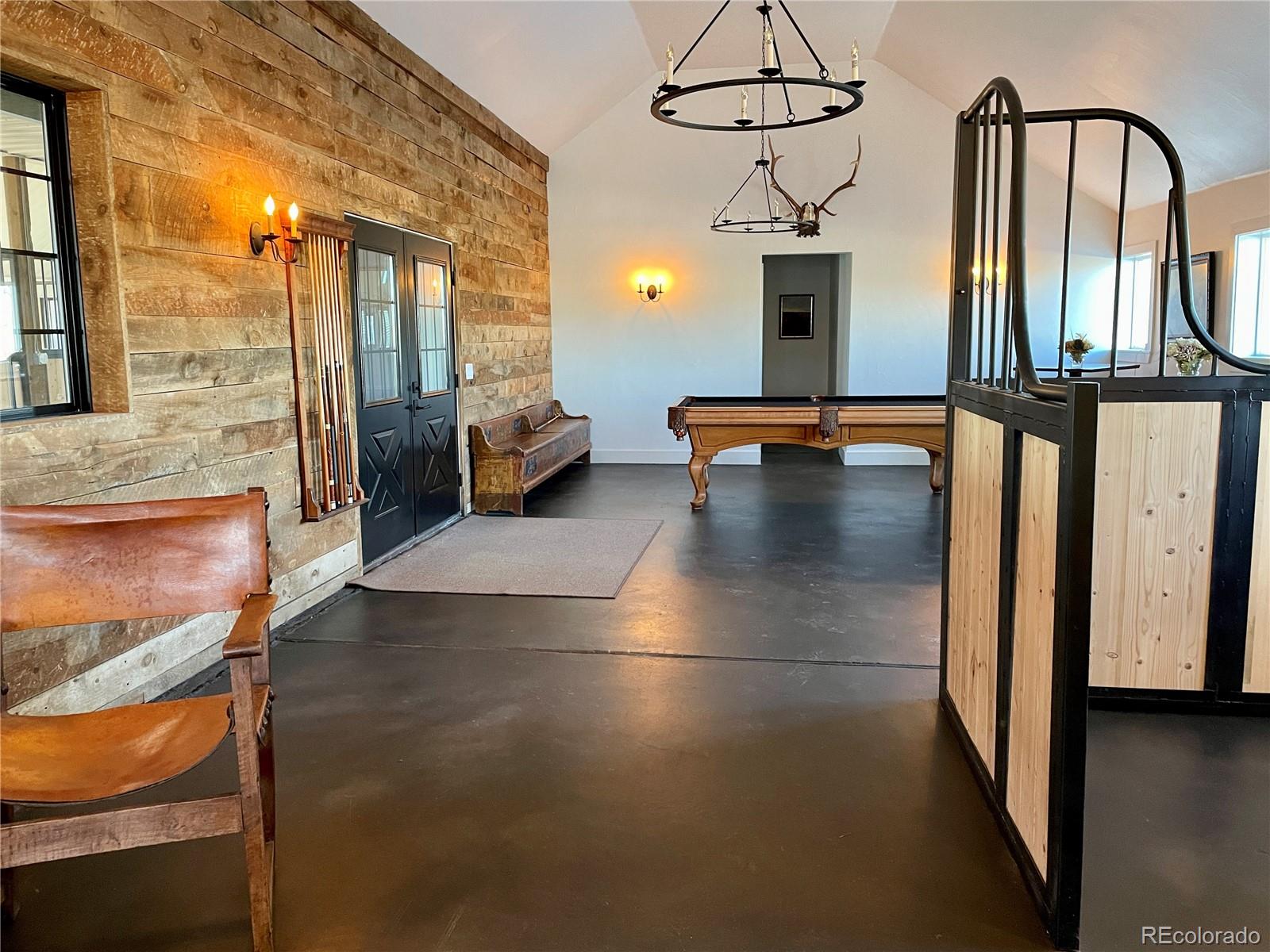 26794 Maul Road Elbert, CO 80106 - Photo 14 of 44 a lobby with furniture and floor to ceiling window