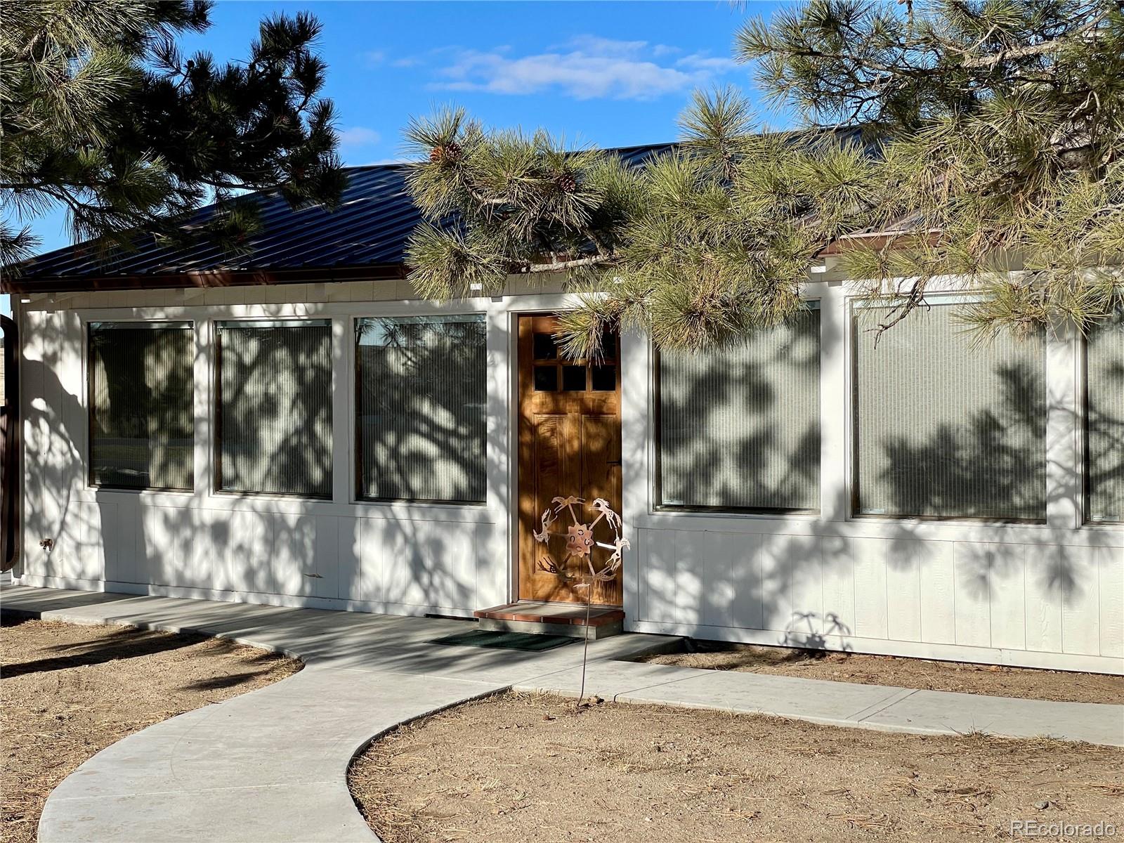 26794 Maul Road Elbert, CO 80106 - Photo 18 of 44 a view of a house with a yard