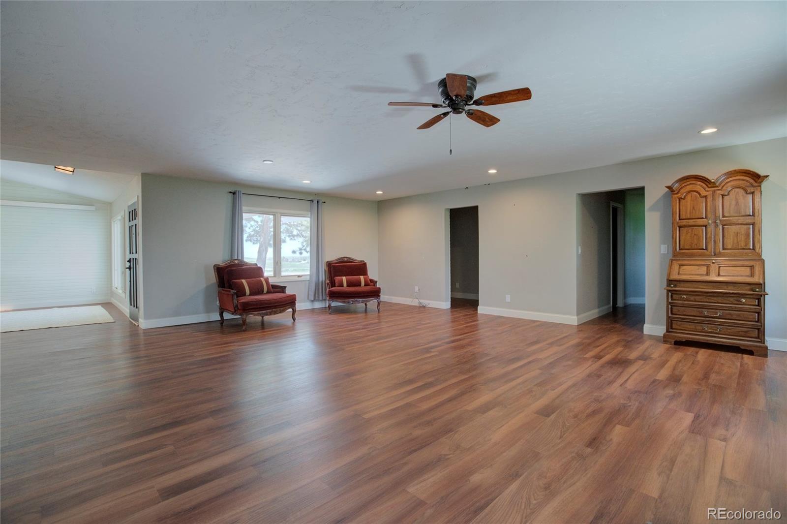 26794 Maul Road Elbert, CO 80106 - Photo 27 of 44 a view of livingroom with hardwood floor and furniture