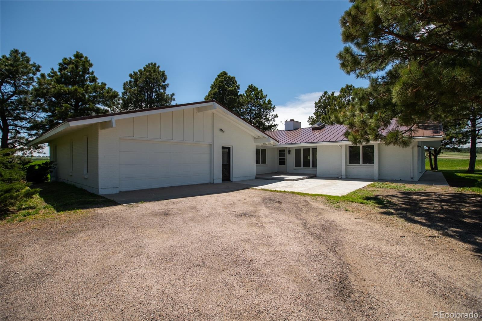 26794 Maul Road Elbert, CO 80106 - Photo 29 of 44 a house with trees in the background