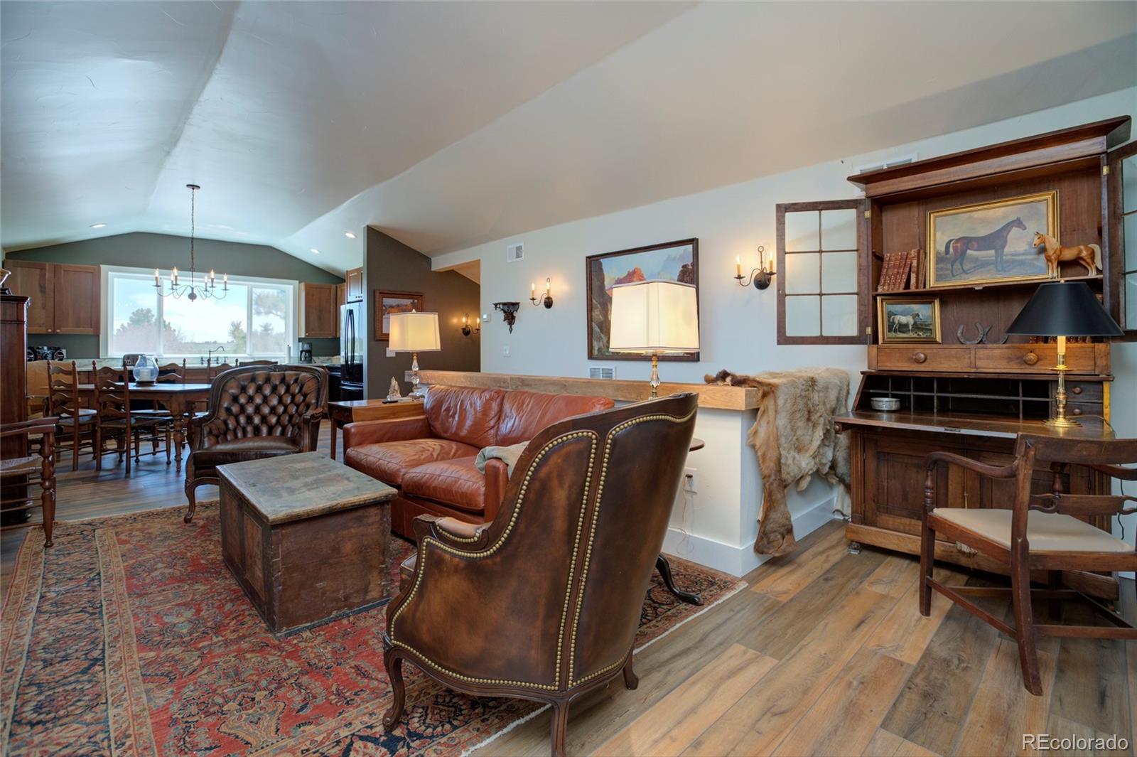26794 Maul Road Elbert, CO 80106 - Photo 31 of 44 a living room with furniture and a wooden floor