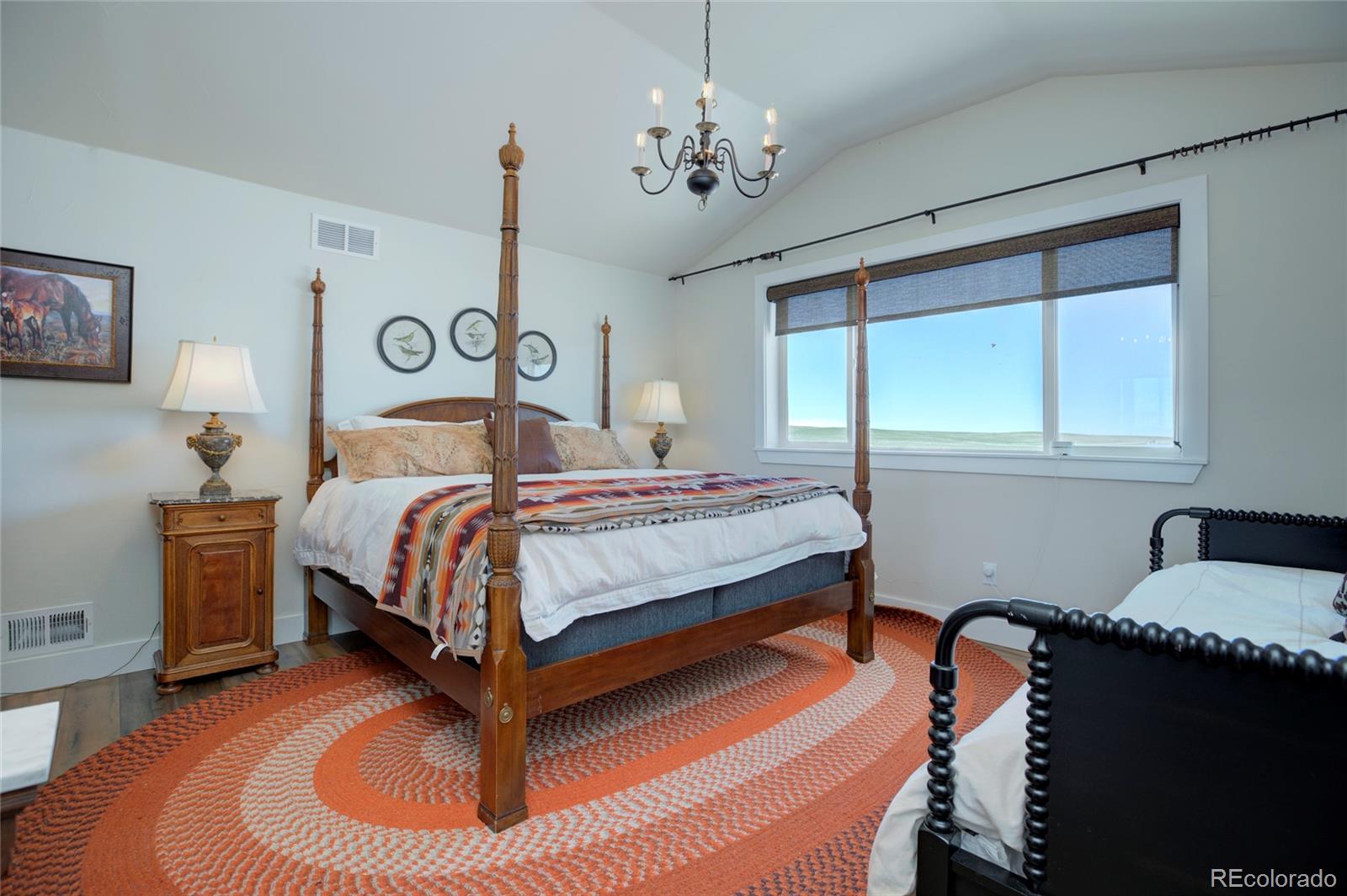 26794 Maul Road Elbert, CO 80106 - Photo 32 of 44 a bedroom with bed and window