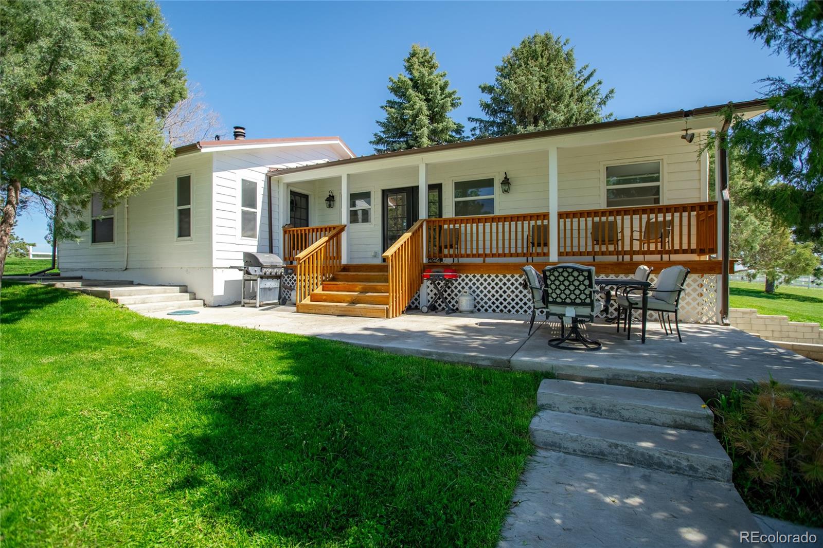 26794 Maul Road Elbert, CO 80106 - Photo 37 of 44 a view of a house with backyard porch and sitting area