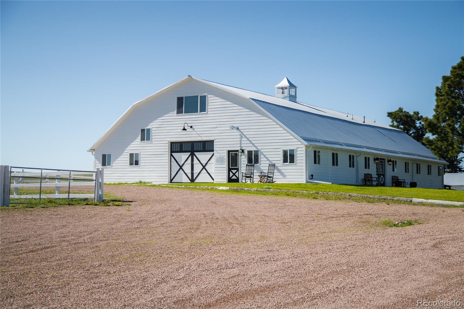 26794 Maul Road Elbert, CO 80106 - Photo 41 of 44 a front view of a house with a yard and porch