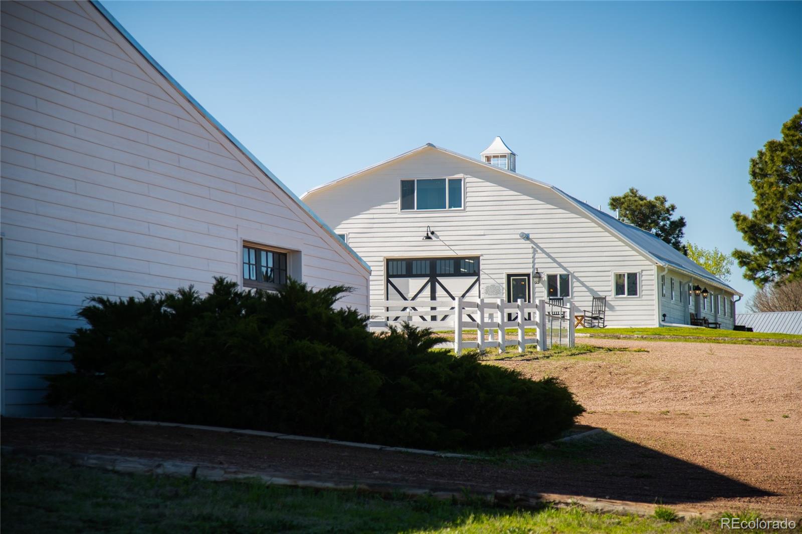 26794 Maul Road Elbert, CO 80106 - Photo 44 of 44 a front view of a house with garden