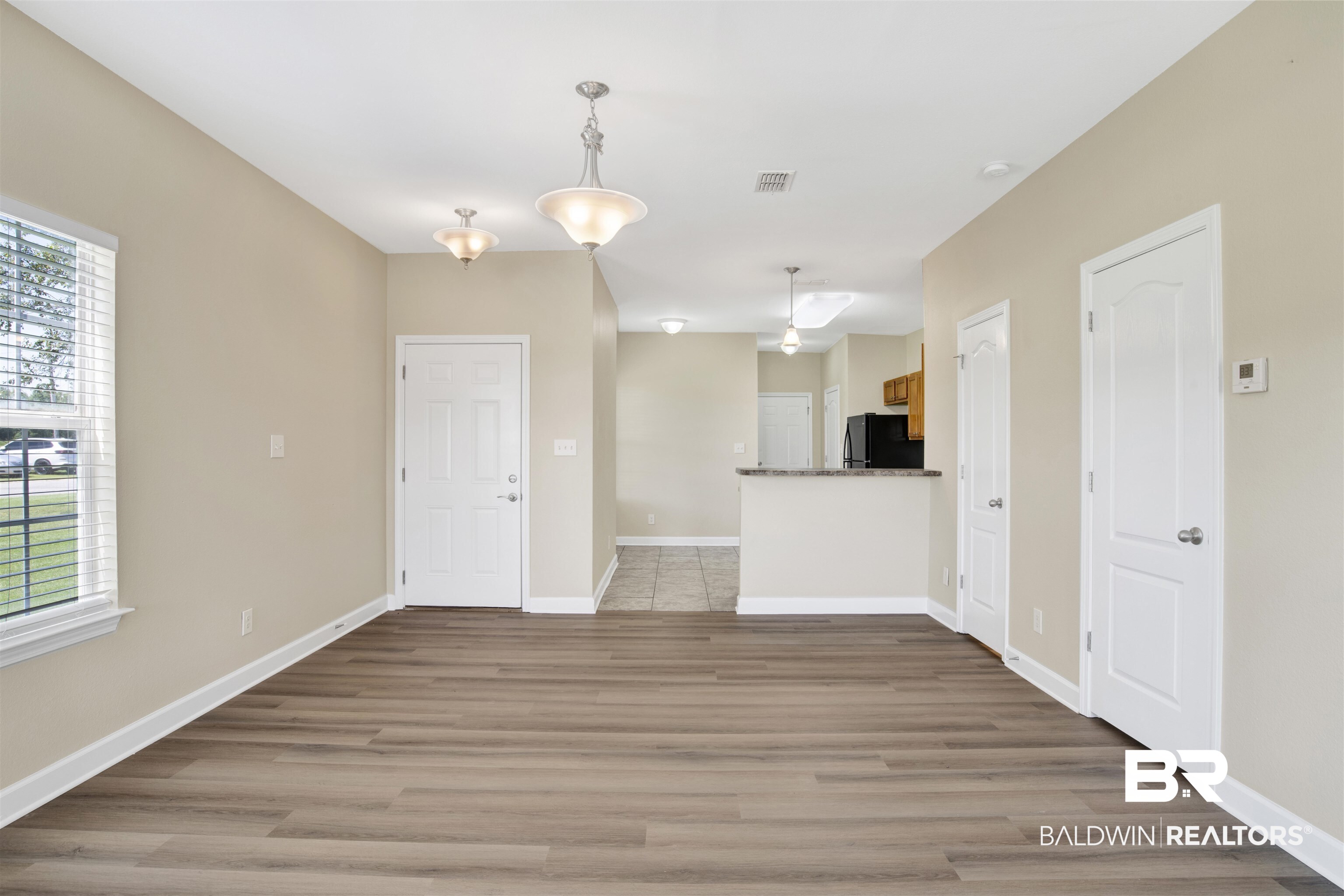 2002 Shelene Way Foley, AL 36535 - Photo 6 of 23 Unfurnished living room featuring light wood-style flooring