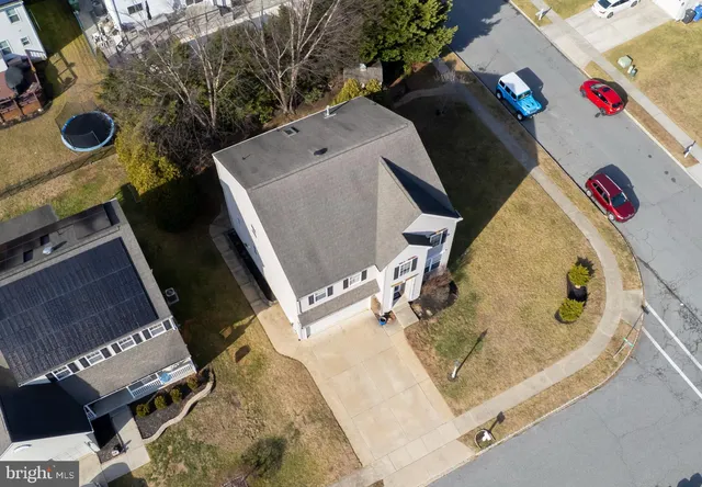 a living room with furniture potted plant and a window