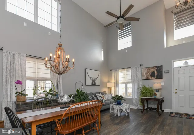 a view of a kitchen with wooden floor and a sink