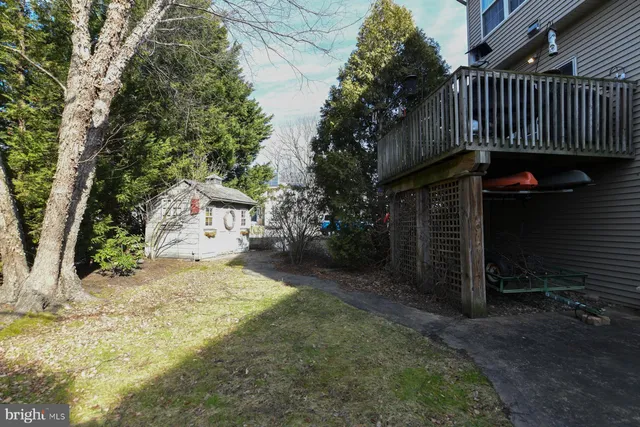 a view of a pathway of a house with a yard