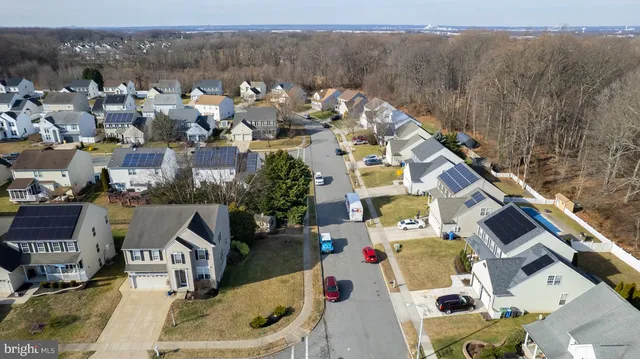 an aerial view of a house with a swimming pool