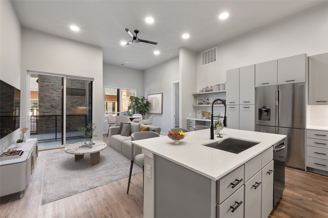 4510 Terry-O Lane, Unit 141 Austin, TX 78745 - Photo 1 of 29 Kitchen with gray cabinetry, a sink, visible vents, and stainless steel appliances