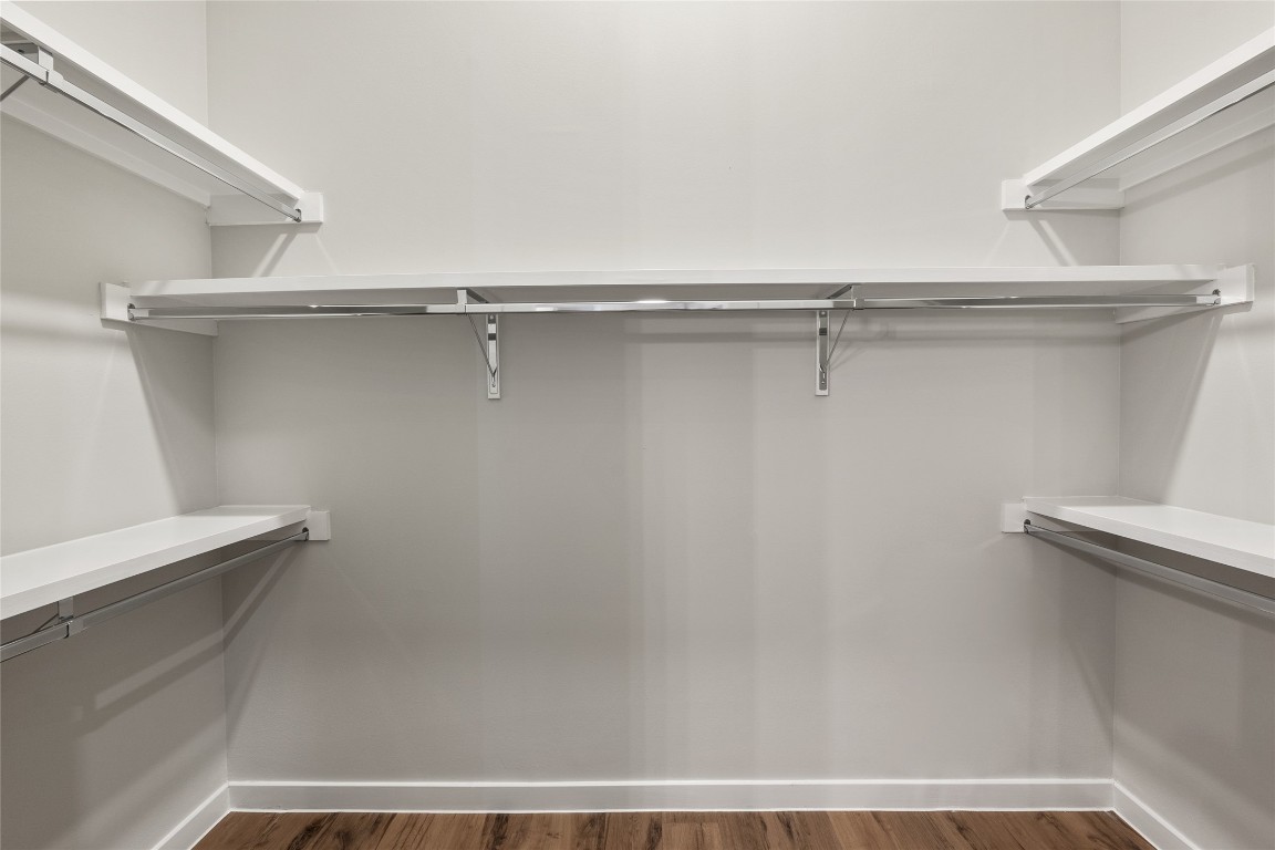 4510 Terry-O Lane, Unit 141 Austin, TX 78745 - Photo 13 of 29 Walk in closet featuring dark wood-type flooring