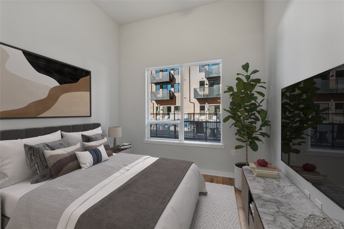 4510 Terry-O Lane, Unit 141 Austin, TX 78745 - Photo 14 of 29 Bedroom with wood finished floors and baseboards