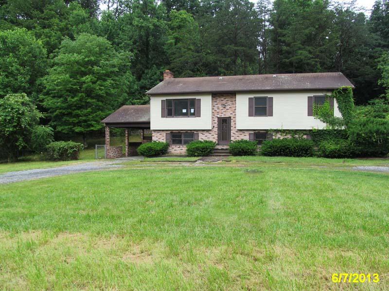 1227 Mountain Pass Road Blue Ridge, VA 24064 - Photo 1 of 8 a view of a house with a yard