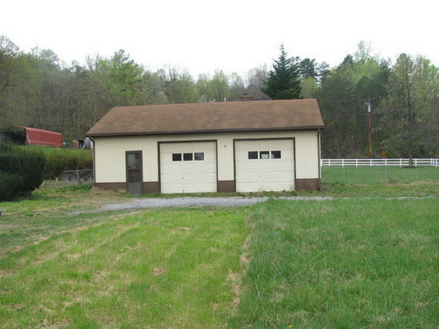 1227 Mountain Pass Road Blue Ridge, VA 24064 - Photo 7 of 8 a house view with a garden space
