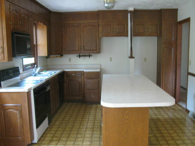 1227 Mountain Pass Road Blue Ridge, VA 24064 - Photo 8 of 8 a kitchen with a sink a stove and cabinets