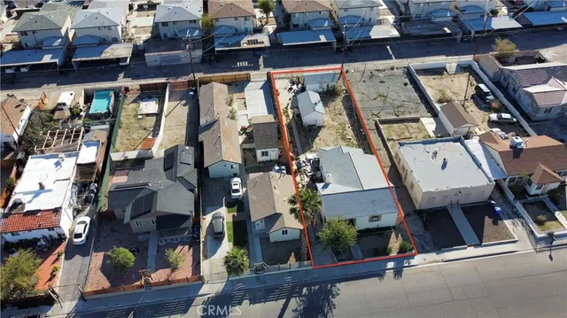 an aerial view of a building with street