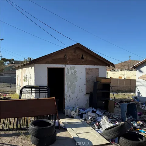 a view of backyard with outdoor seating