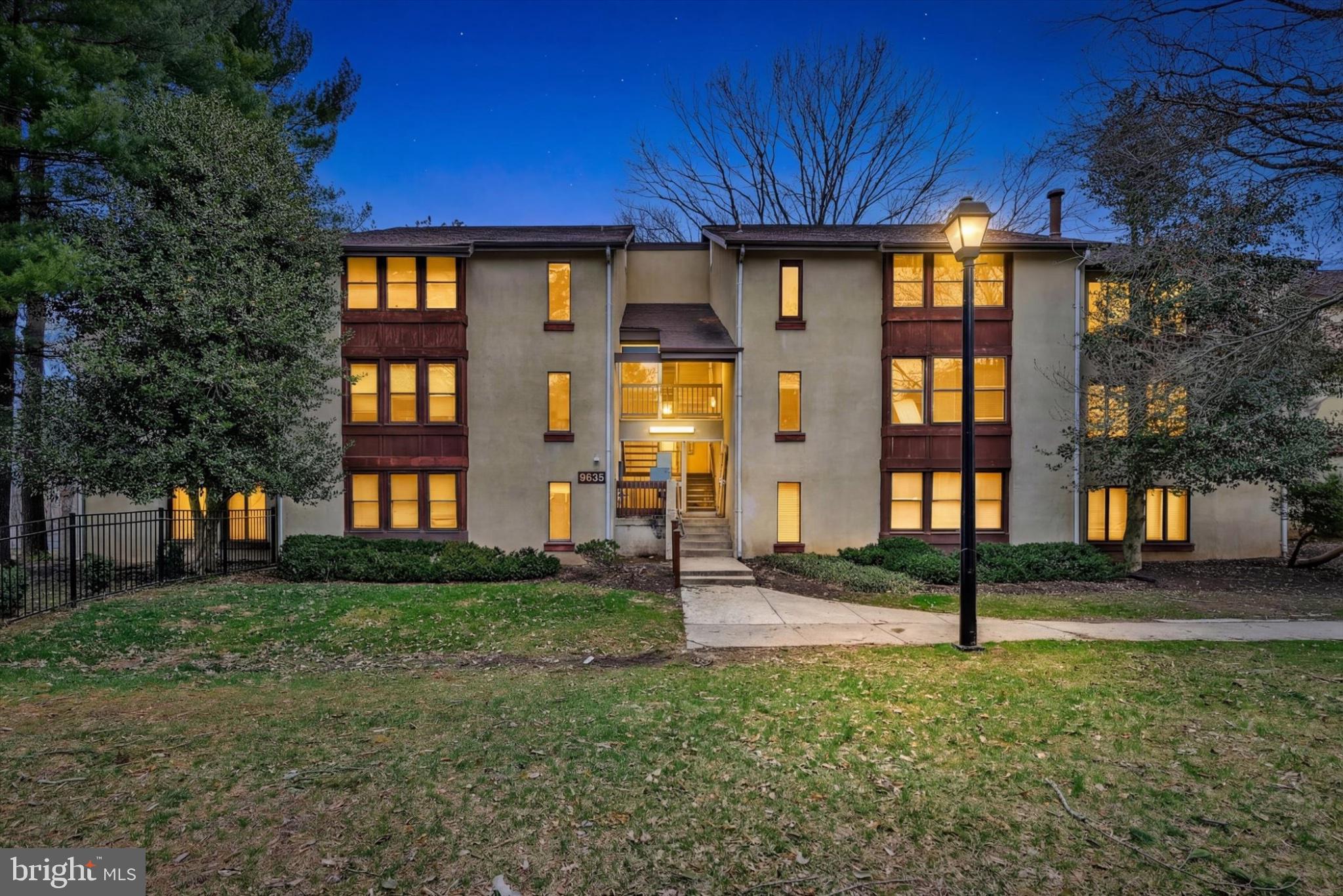 Charming apartment complex at dusk.