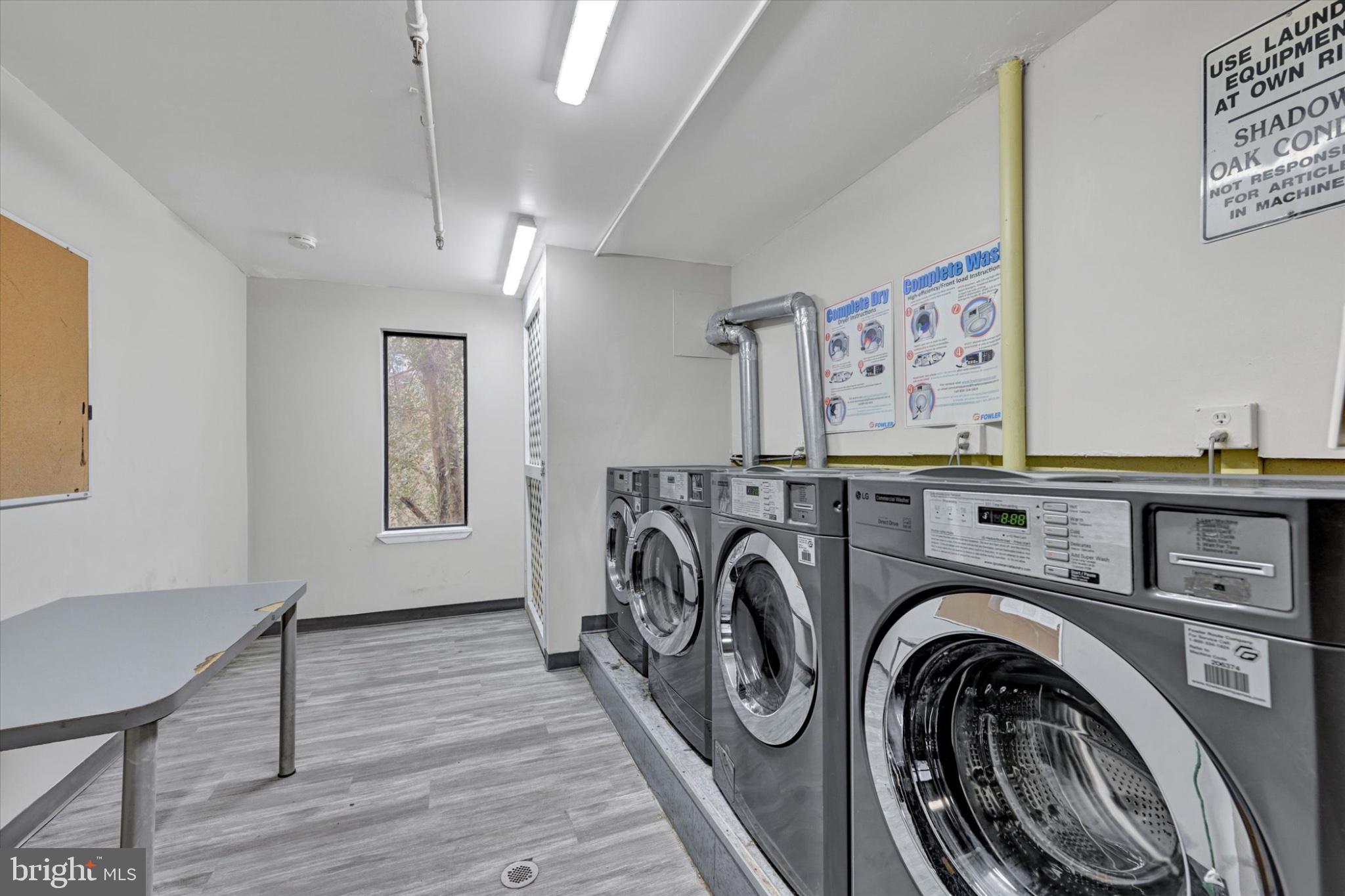 9635 White Acre Road, Unit B4 Columbia, MD 21045 - Photo 19 of 21 Bright and functional laundry space.
