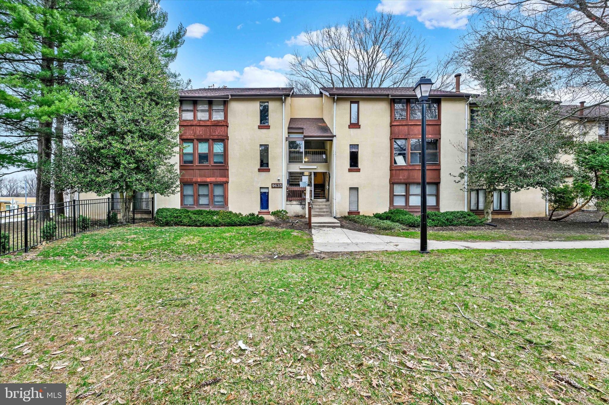 9635 White Acre Road, Unit B4 Columbia, MD 21045 - Photo 2 of 21 Charming apartment complex with greenery.