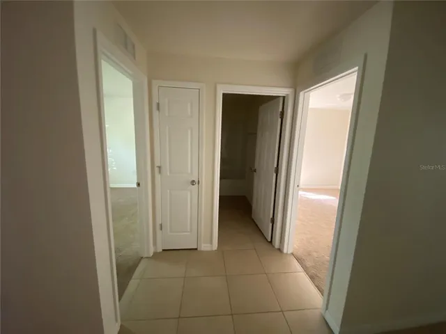 a view of a hallway with a closet