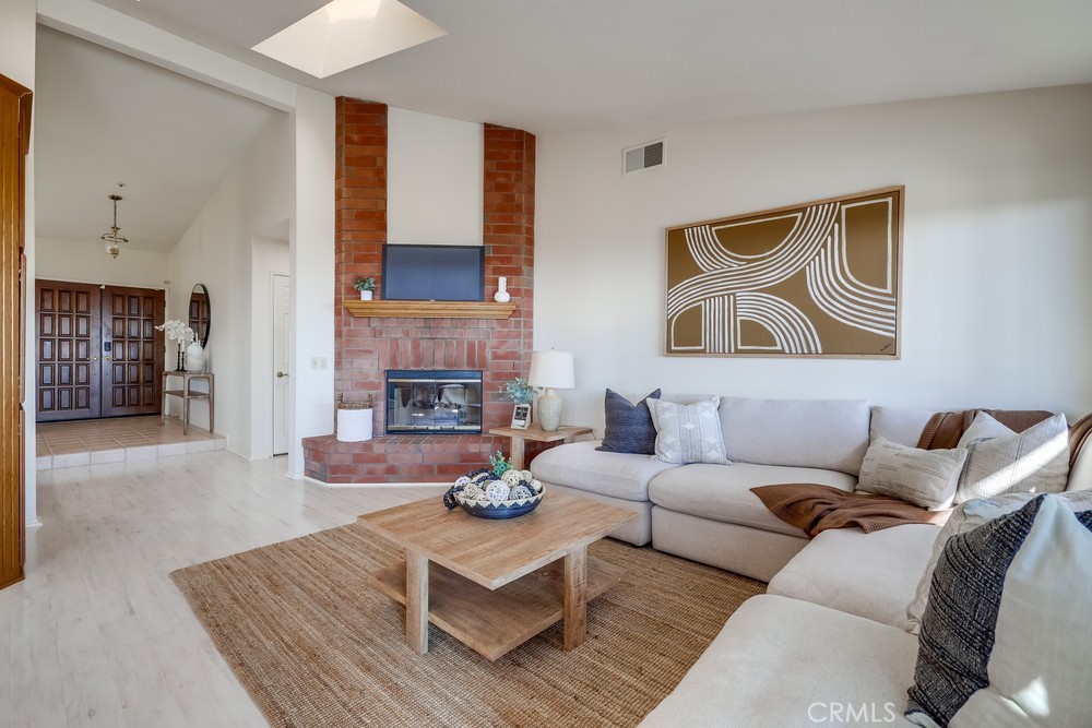 2945 Via Blanco San Clemente, CA 92673 - Photo 22 of 60 a living room with furniture and a fireplace