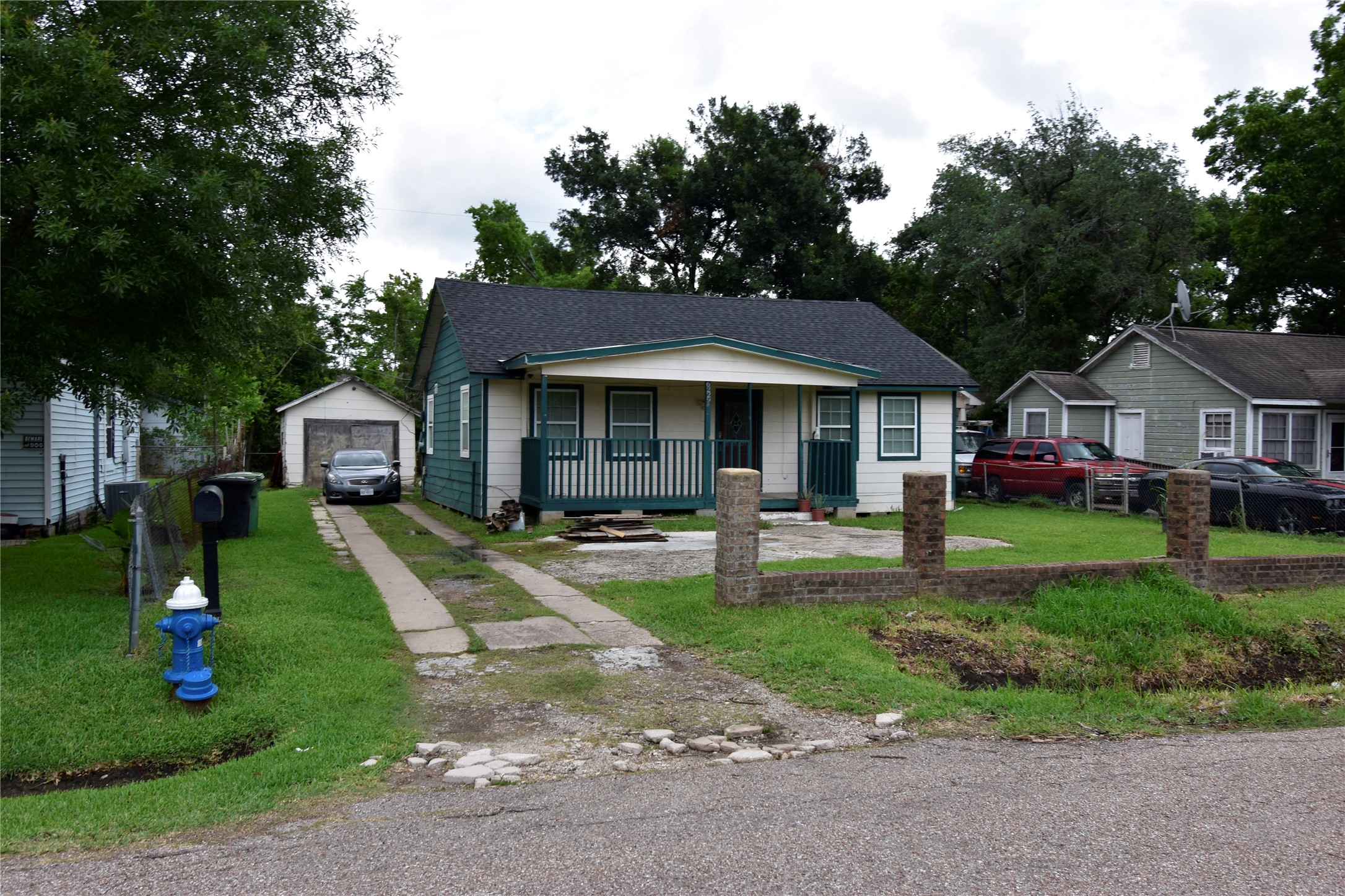 a front view of a house with a yard table and chairs