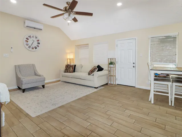 a living room with furniture and a table